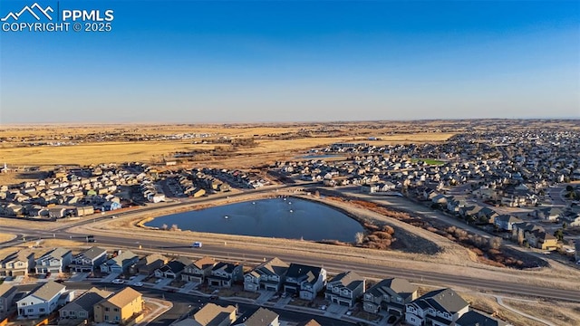 aerial view featuring a water view and a residential view