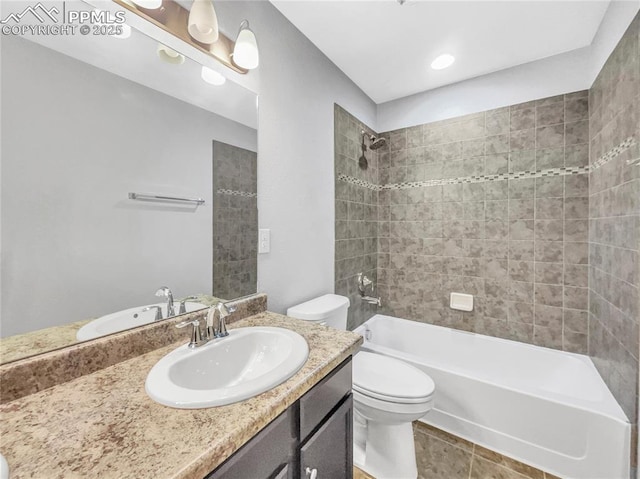 bathroom featuring shower / bath combination, vanity, toilet, and tile patterned floors