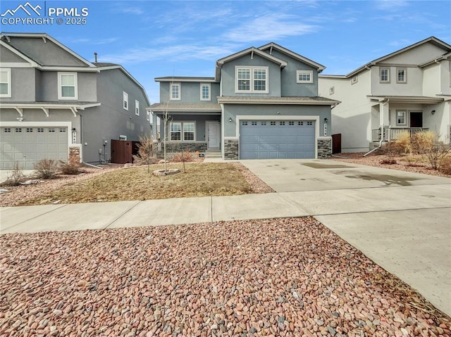 view of front facade with a garage, concrete driveway, stone siding, a residential view, and stucco siding