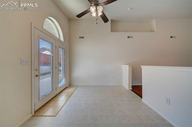 entrance foyer with a ceiling fan, visible vents, and baseboards