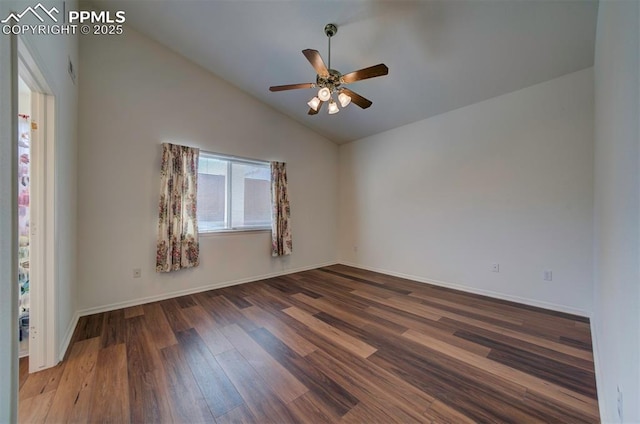 unfurnished room with vaulted ceiling, wood finished floors, a ceiling fan, and baseboards