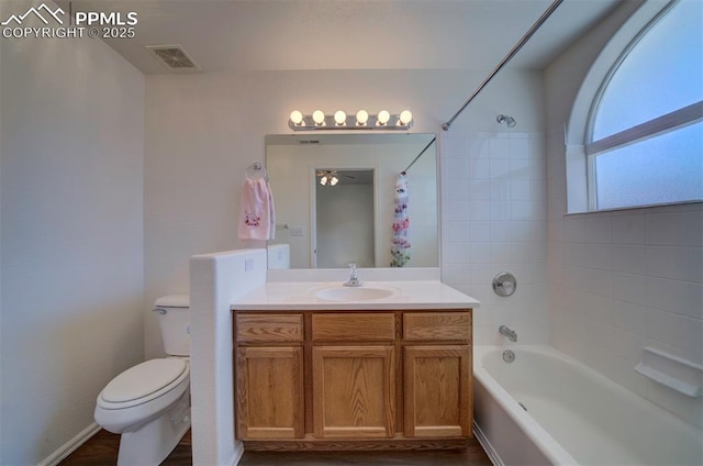 bathroom featuring toilet, shower / bath combination, visible vents, and vanity