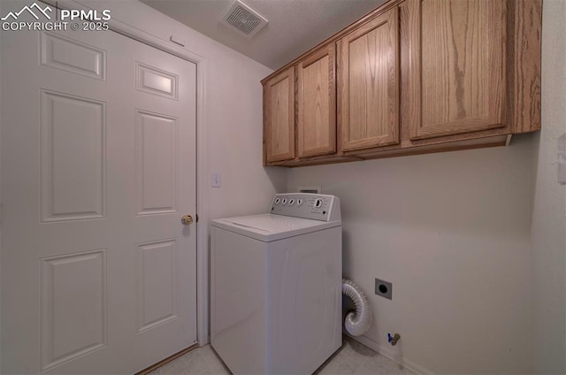 laundry area with washer / dryer, visible vents, and cabinet space