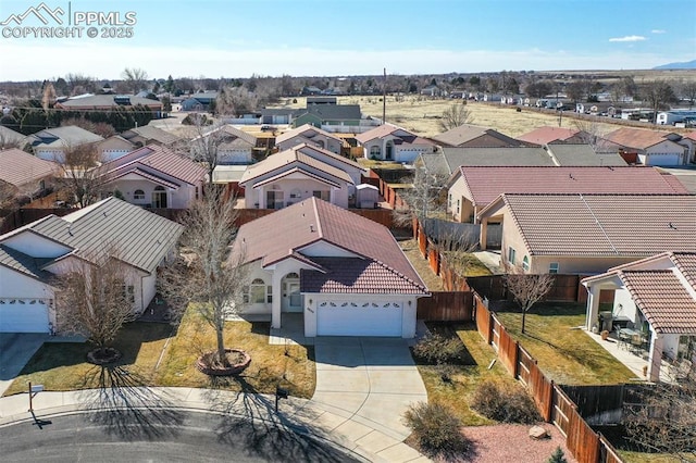 birds eye view of property with a residential view