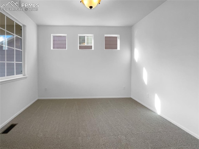 spare room featuring carpet flooring