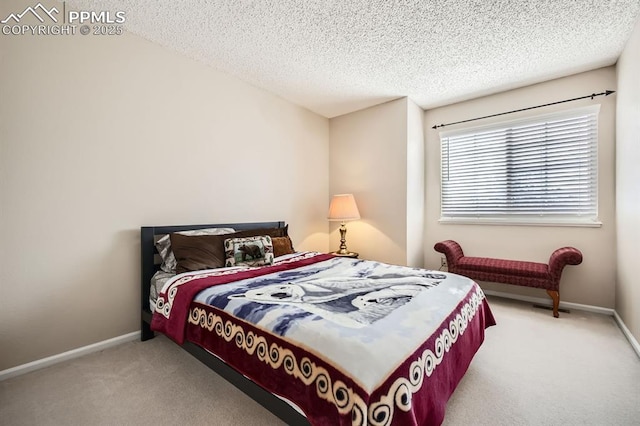 bedroom featuring carpet flooring, a textured ceiling, and baseboards