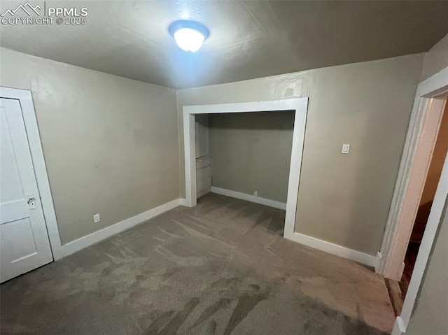 unfurnished bedroom with carpet and baseboards