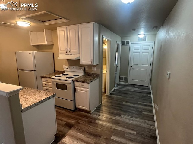 kitchen with white appliances, white cabinetry, visible vents, and under cabinet range hood