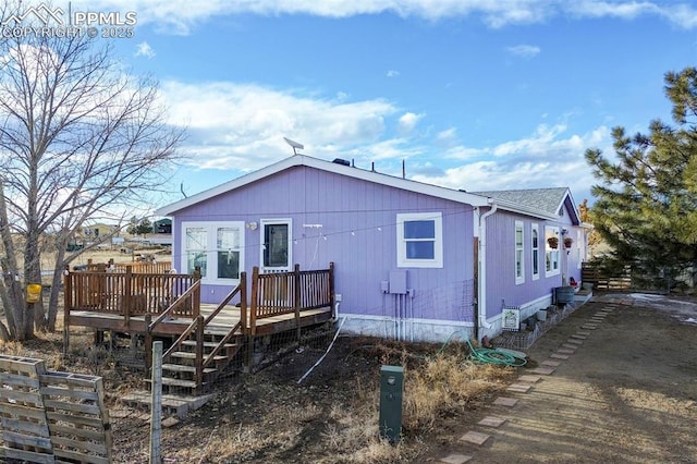 rear view of house with a deck