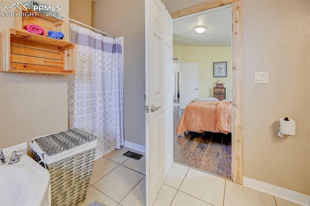 bathroom featuring tile patterned flooring