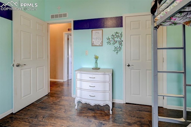 hall with dark hardwood / wood-style flooring