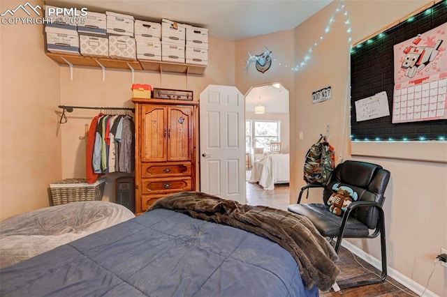 bedroom featuring dark hardwood / wood-style floors