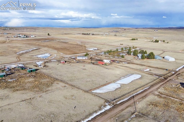 birds eye view of property with a rural view