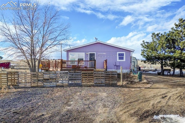 rear view of house with a deck