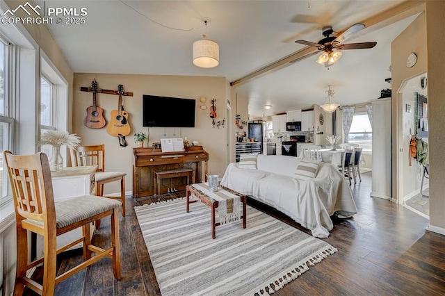 living room with ceiling fan, lofted ceiling with beams, and dark hardwood / wood-style flooring