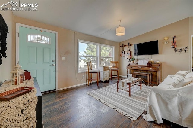 entryway featuring dark wood-type flooring and lofted ceiling