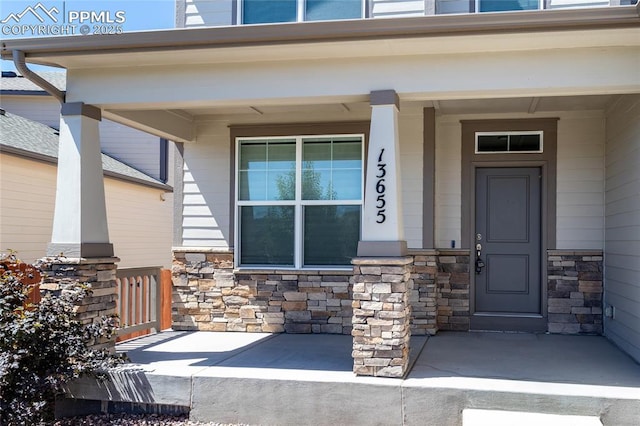 entrance to property featuring covered porch