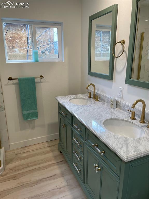 bathroom featuring vanity and wood-type flooring