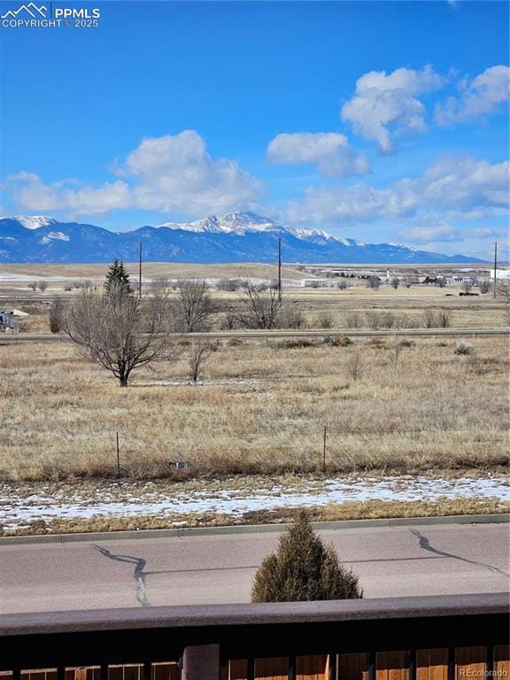 view of mountain feature with a rural view