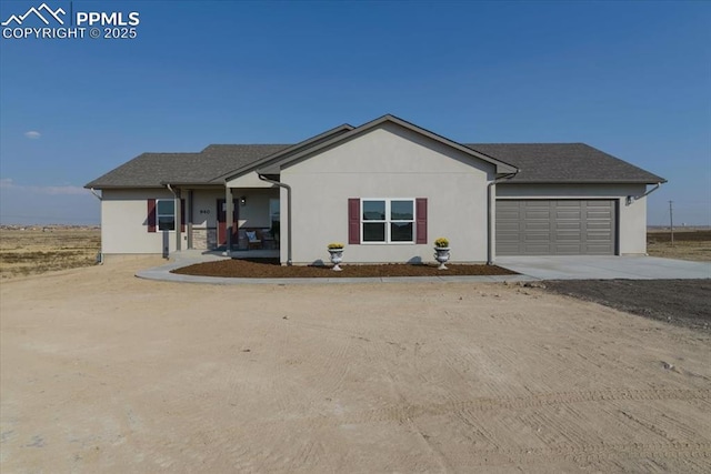 ranch-style house featuring a garage and a porch