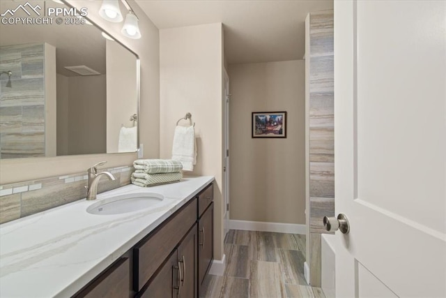 bathroom with hardwood / wood-style flooring and vanity