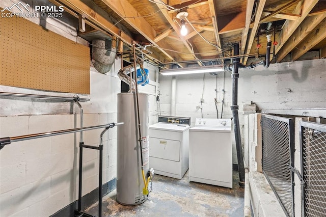 unfinished below grade area featuring gas water heater and washing machine and dryer