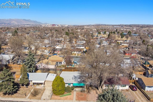 drone / aerial view with a residential view and a mountain view