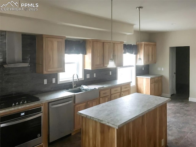 kitchen with tasteful backsplash, wall chimney exhaust hood, a kitchen island, decorative light fixtures, and stainless steel appliances