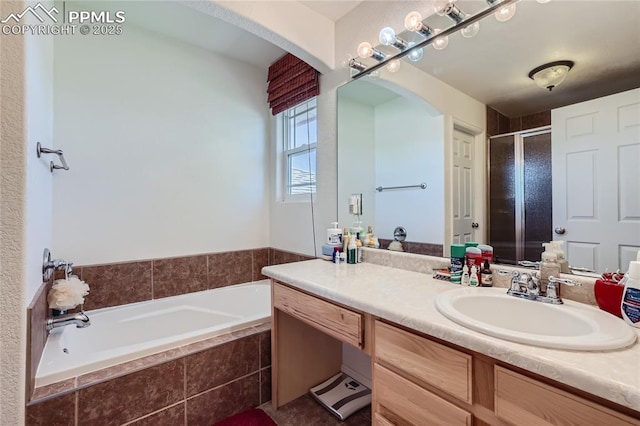 full bathroom featuring a garden tub, a shower stall, and vanity