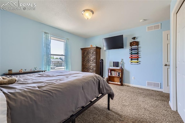 carpeted bedroom with baseboards and visible vents