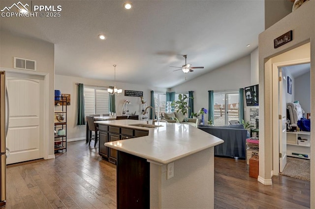 kitchen with light countertops, dark wood finished floors, visible vents, and a sink