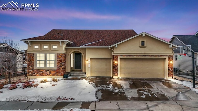 view of front of property featuring a garage and cooling unit