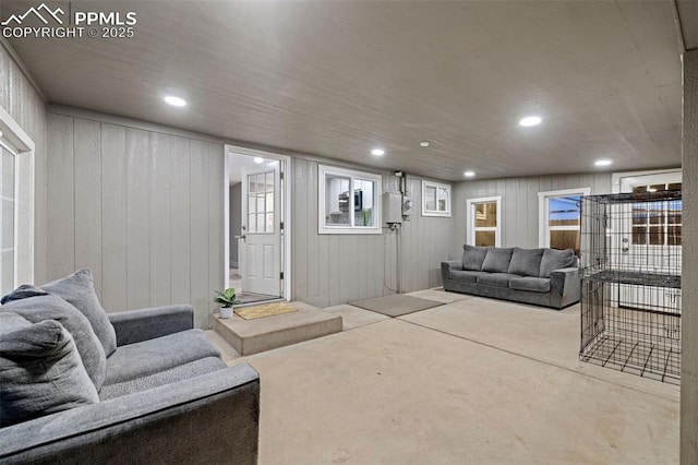 living room featuring concrete flooring and recessed lighting