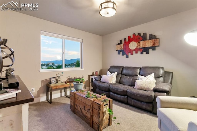 living area featuring carpet and a mountain view