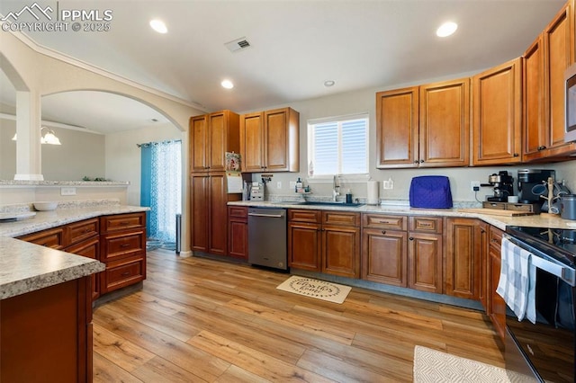 kitchen with brown cabinets, electric range oven, visible vents, and stainless steel dishwasher