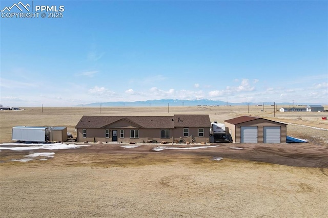 exterior space featuring a garage and a mountain view