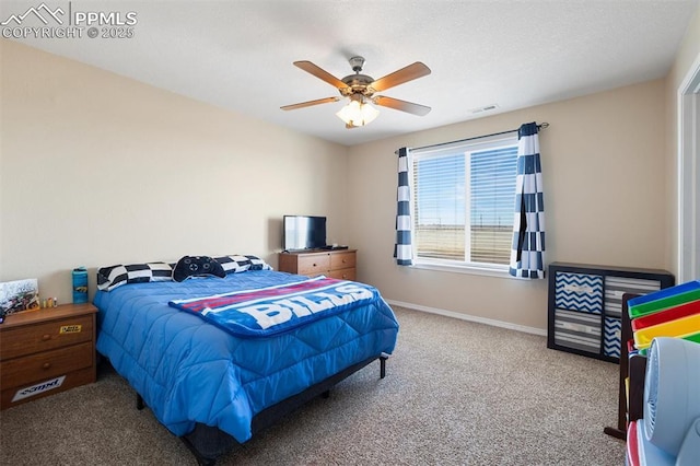 bedroom with carpet floors, visible vents, ceiling fan, and baseboards