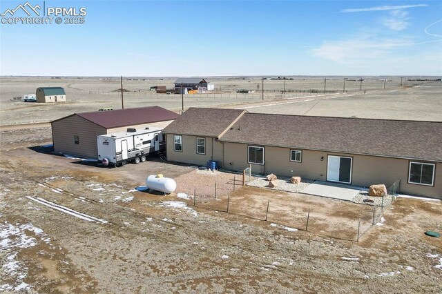 birds eye view of property featuring a rural view