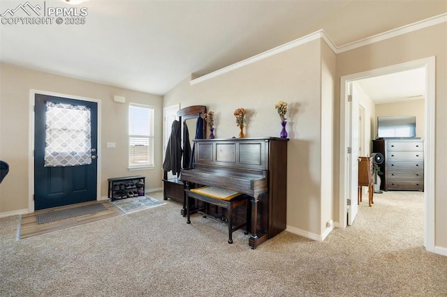 entryway featuring light carpet, crown molding, and baseboards