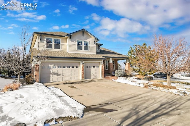 view of front of house with a garage, concrete driveway, and brick siding