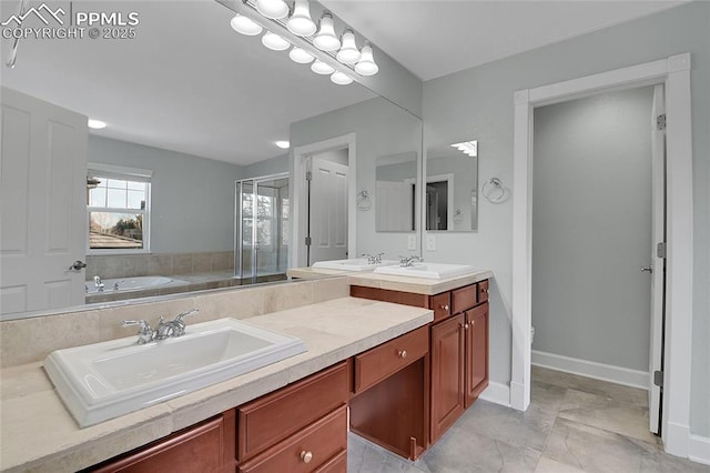 bathroom with double vanity, a stall shower, a sink, and a bath