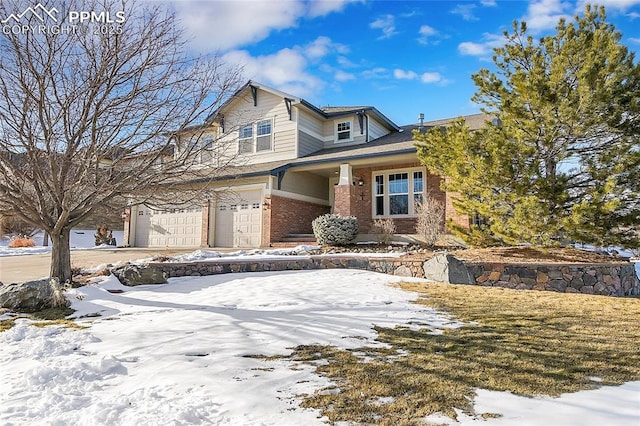 view of front of house with concrete driveway, brick siding, and an attached garage