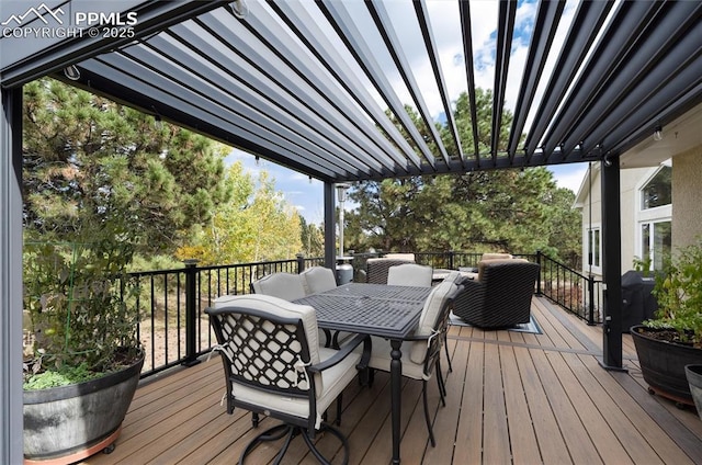 wooden deck featuring a pergola and outdoor dining space