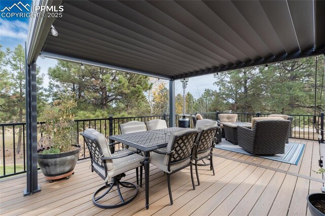 deck with outdoor dining area