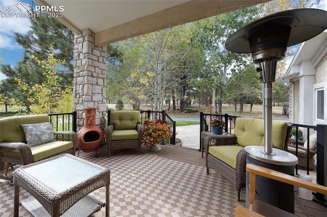 wooden deck featuring outdoor lounge area