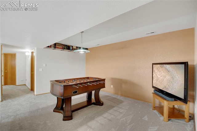 playroom with carpet floors, visible vents, and baseboards