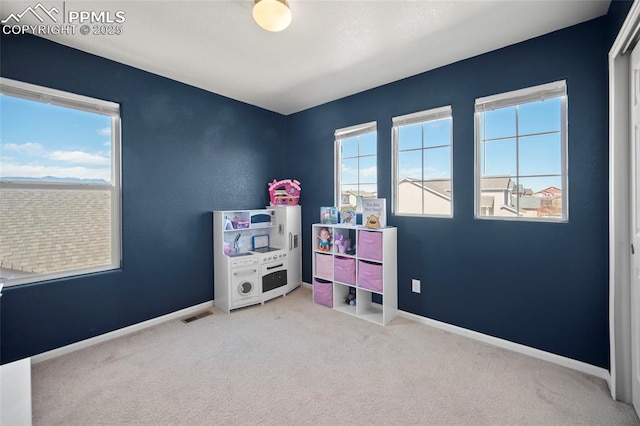 game room featuring carpet flooring, visible vents, and baseboards