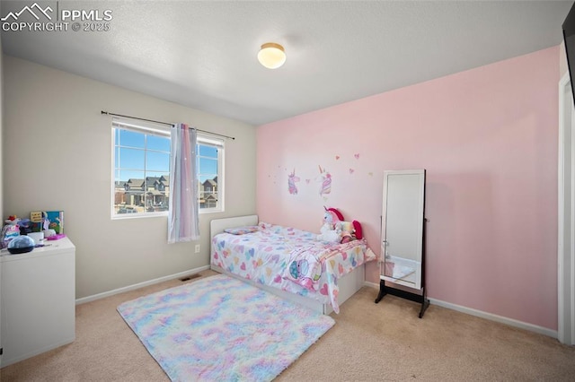 bedroom featuring carpet, visible vents, and baseboards