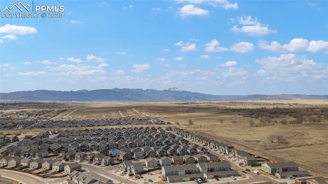 bird's eye view with a residential view and a mountain view