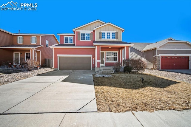 view of front of home featuring driveway, an attached garage, and board and batten siding